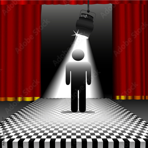 Person in spotlight on checkerboard floor