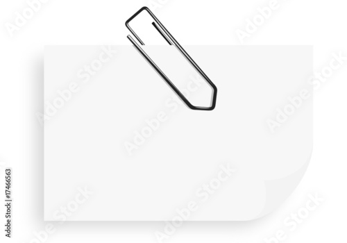White sticky note with paper clip