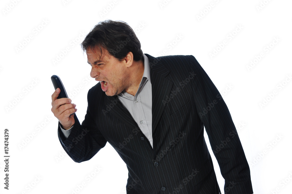 Studio Shot of Business Man shouting in his Phone. Studio Shot of Business Man shouting in his Phone.