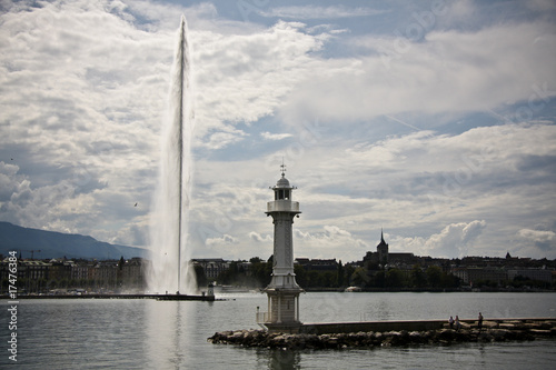 Famous fountain Jet D'Eau and lighthouse in Geneva, Switzerland