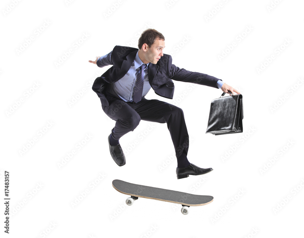 A businessman with skateboard jumping A businessman with skateboard jumping