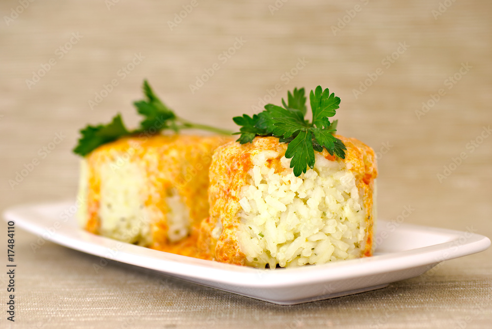 Rice with paprika chicken sauce and parsley on plate Rice with paprika chicken sauce and parsley on plate