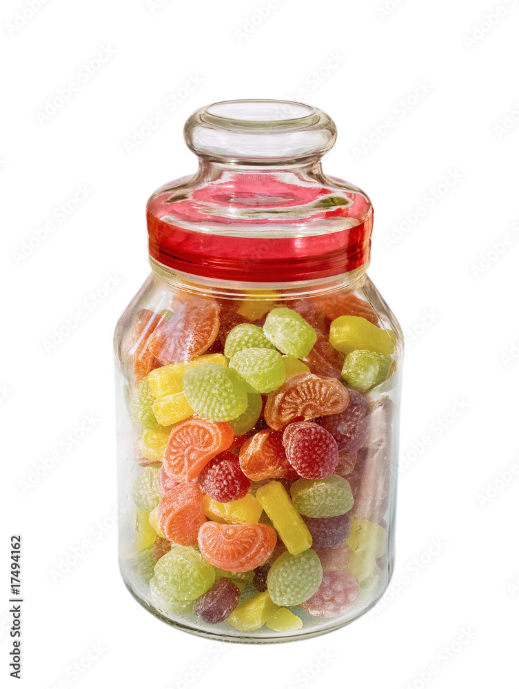 Different colors of confectionary in the glass jar Different colors of confectionary in the glass jar