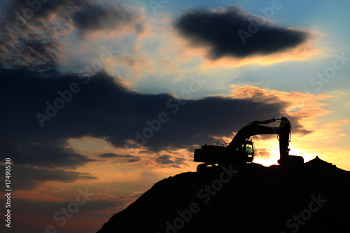 skyline excavator with colored sunset