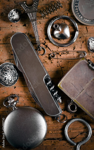 composition with knife, pocket watch and lighter