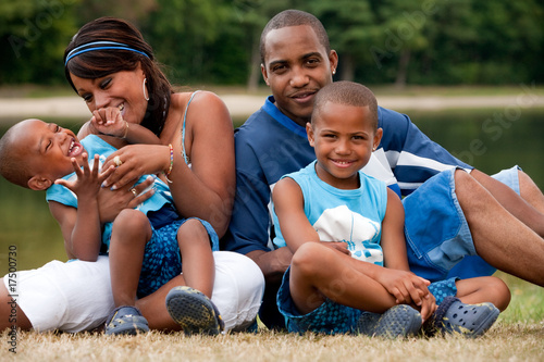 African family is playing with the youngest child photo