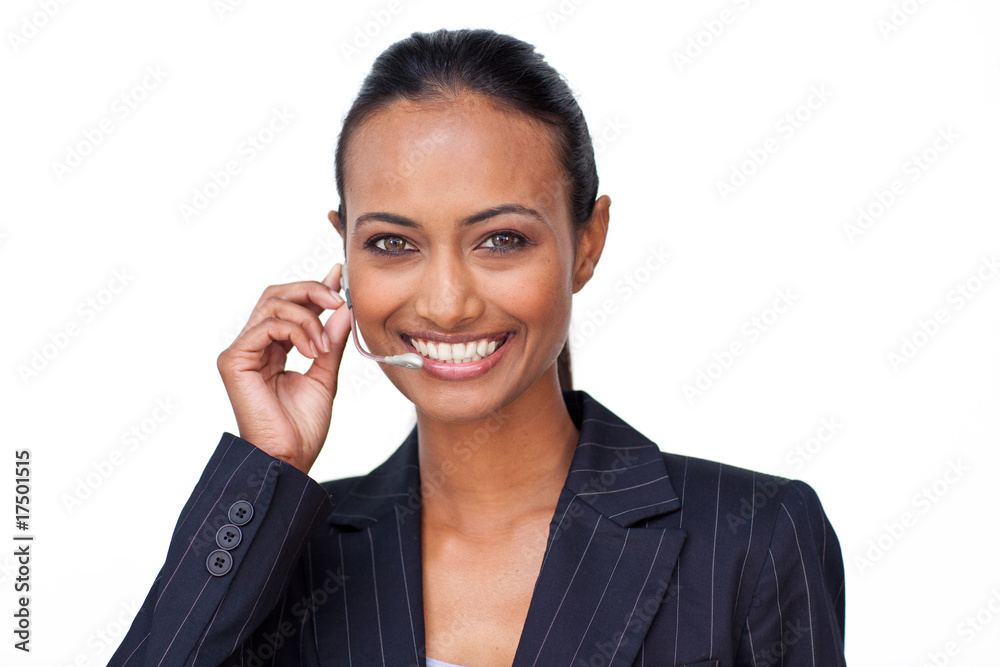Smiling Indian businesswoman talking on a headset Smiling Indian businesswoman talking on a headset