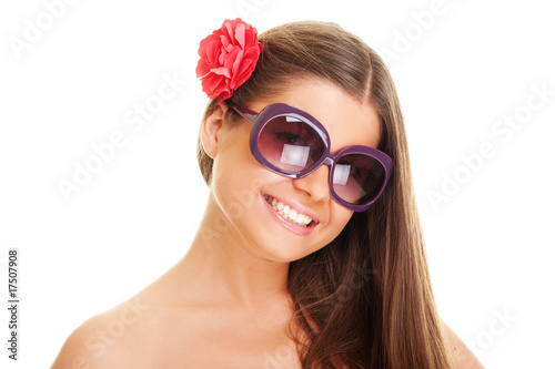 smiley young woman in sunglasses