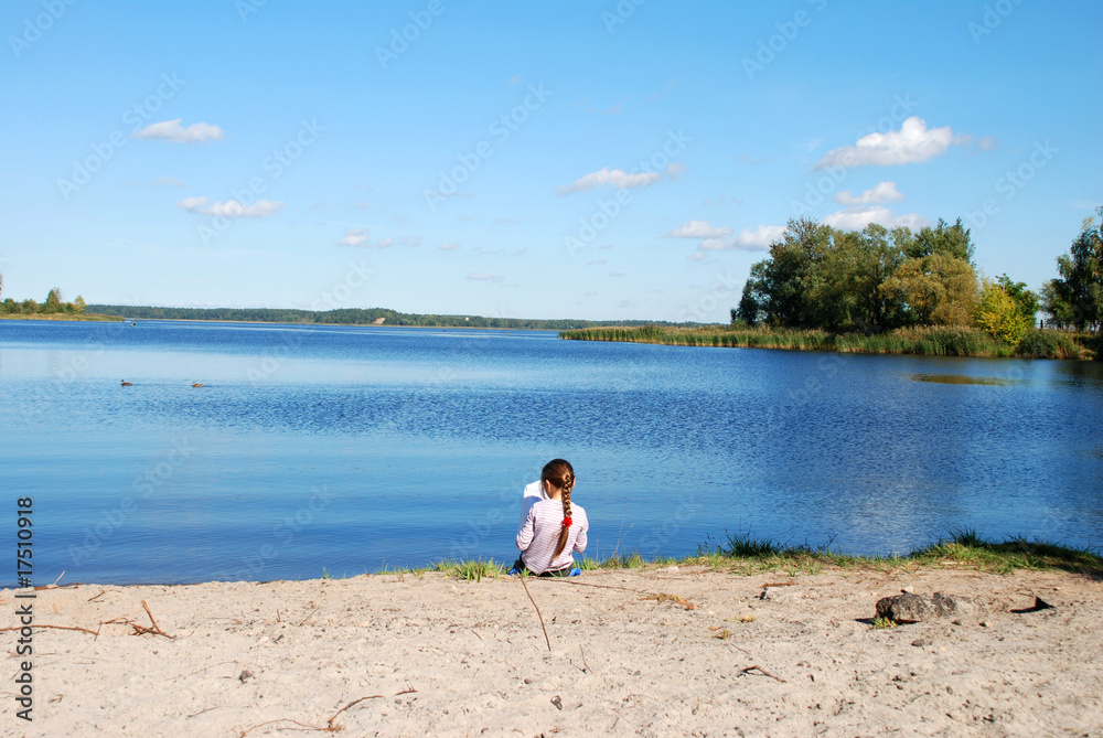 Girls sitting on the beach