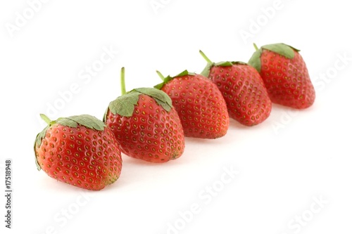 Five strawberries forming a line