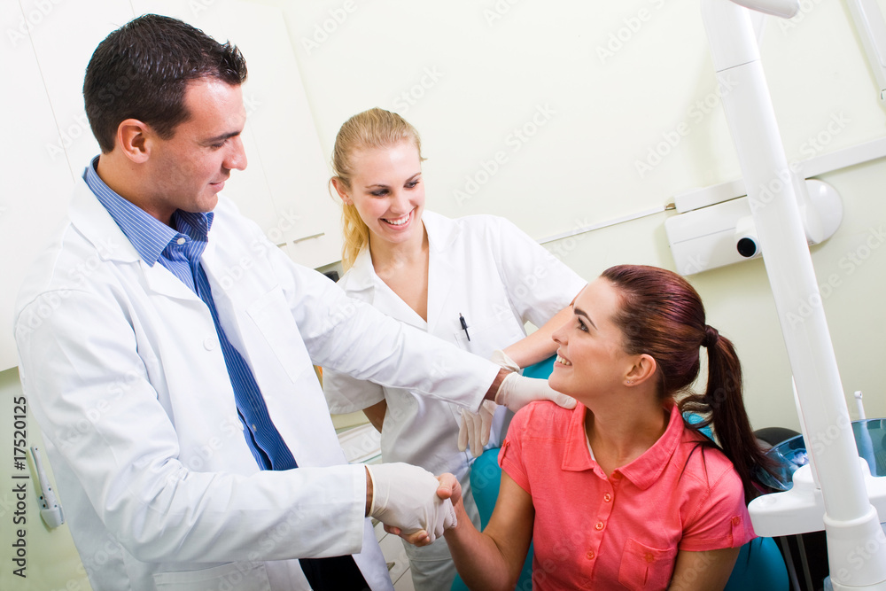 dentist congralating patient for successful operation dentist congralating patient for successful operation