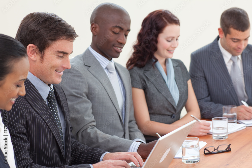 Fototapeta premium Business people in a meeting taking notes