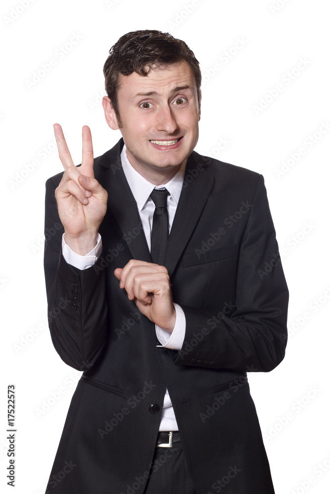 intimidated businessman showing the peace sign intimidated businessman showing the peace sign