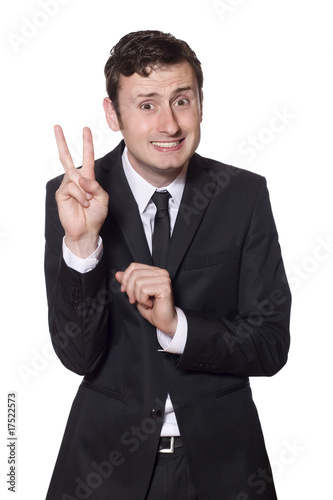 intimidated businessman showing the peace sign