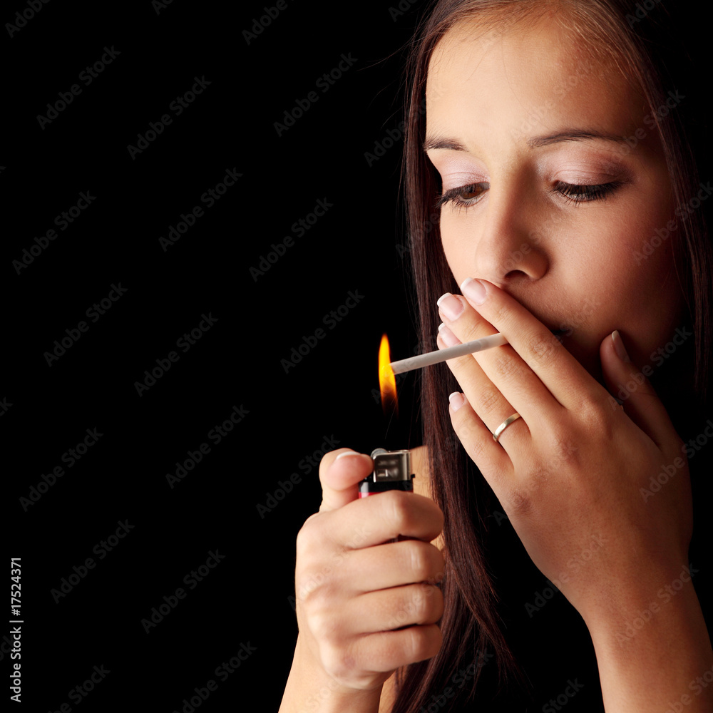 Obraz premium Woman smoking over black