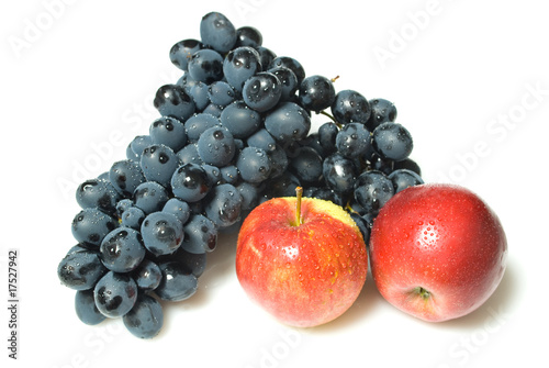 Red grape and apples on white background.