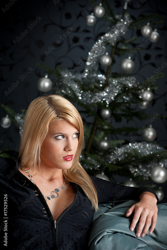 Sexy blond woman on silver Christmas background Sexy blond woman on silver Christmas background