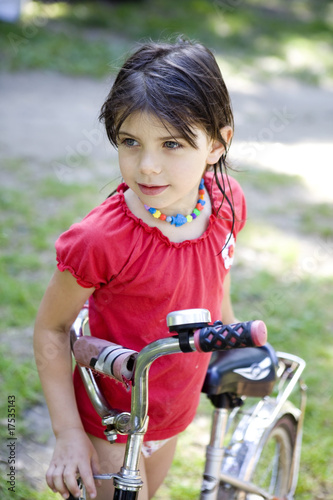 Young girl on the bicycle