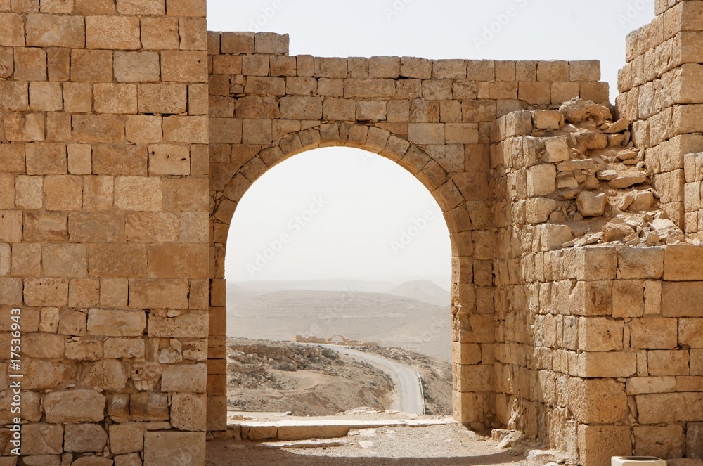 Ancient stone arch and wall with desert view during sandstorm Stock ...