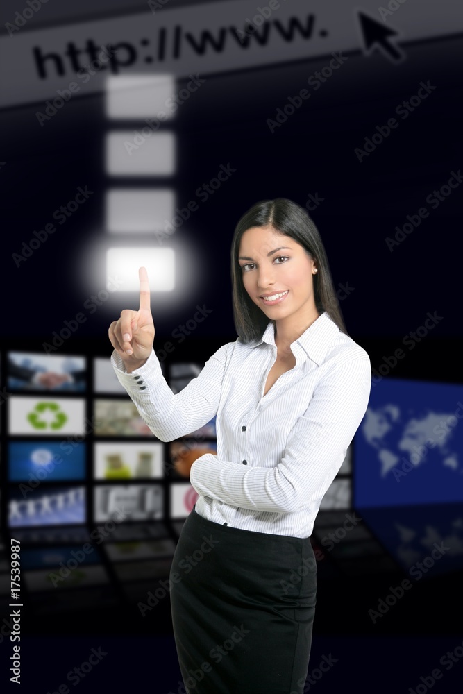 Brunette businesswoman touching virtual pad Brunette businesswoman touching virtual pad