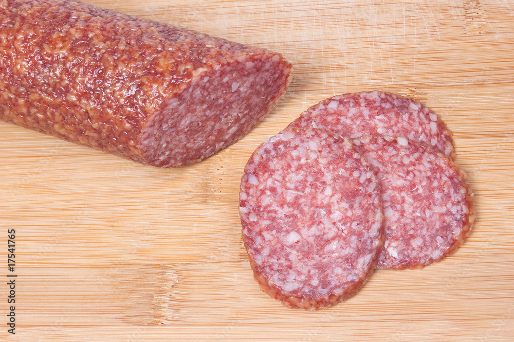 Close up of sliced salami on cutting board Close up of sliced salami on cutting board
