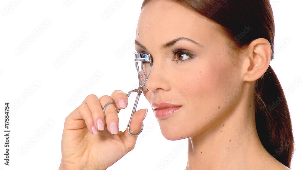 Beautiful and sexy woman is doing her eyelashes Beautiful and sexy woman is doing her eyelashes