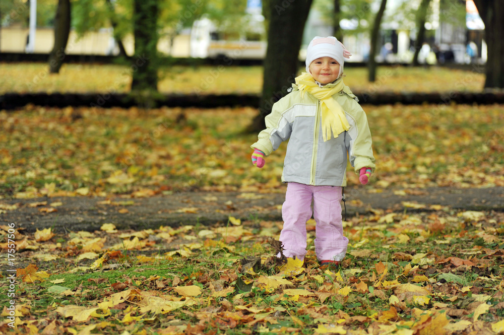 girl playing in autumn park girl playing in autumn park
