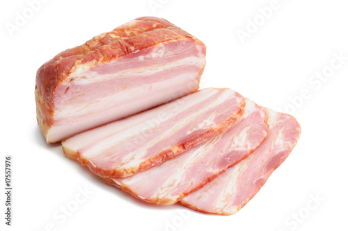 Smoked pork bacon and its slices photo
