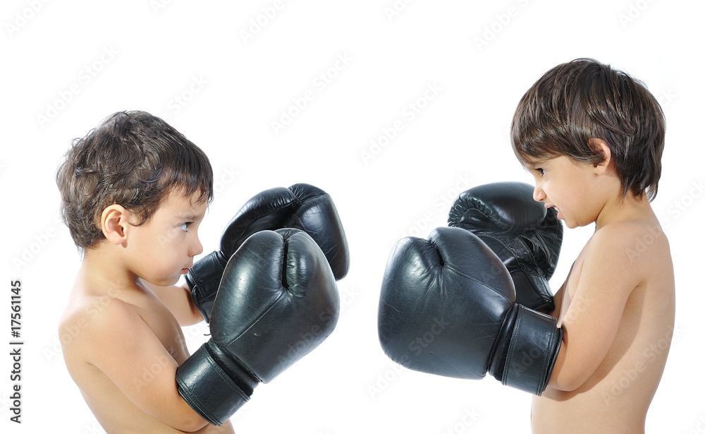 Two children are fighting with boxing gloves Two children are fighting with boxing gloves