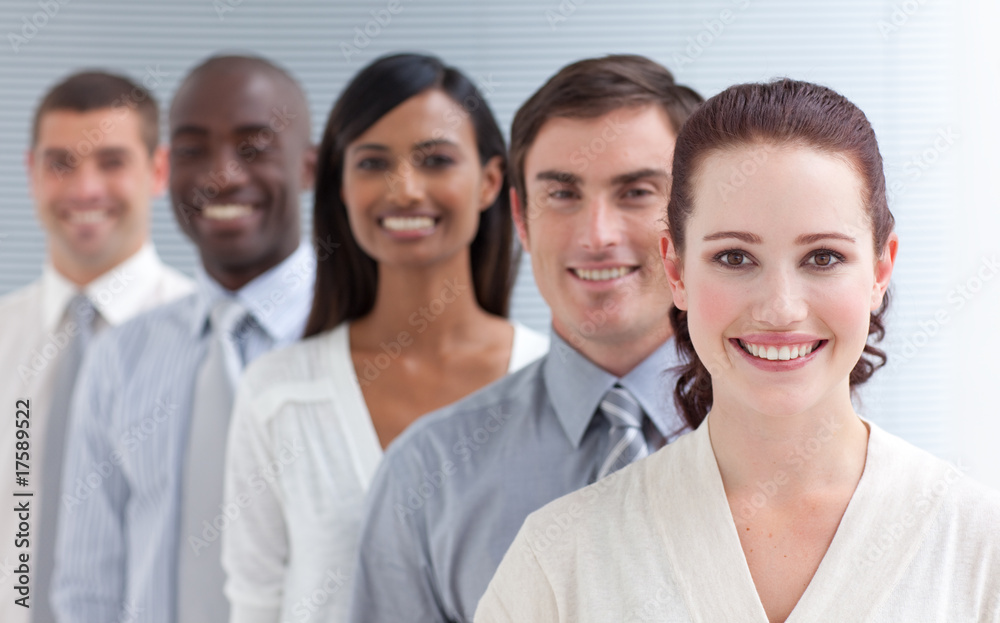 Business team in a line. Focus on a beautiful woman Business team in a line. Focus on a beautiful woman