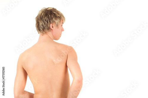 Rear view of naked boy, studio shot