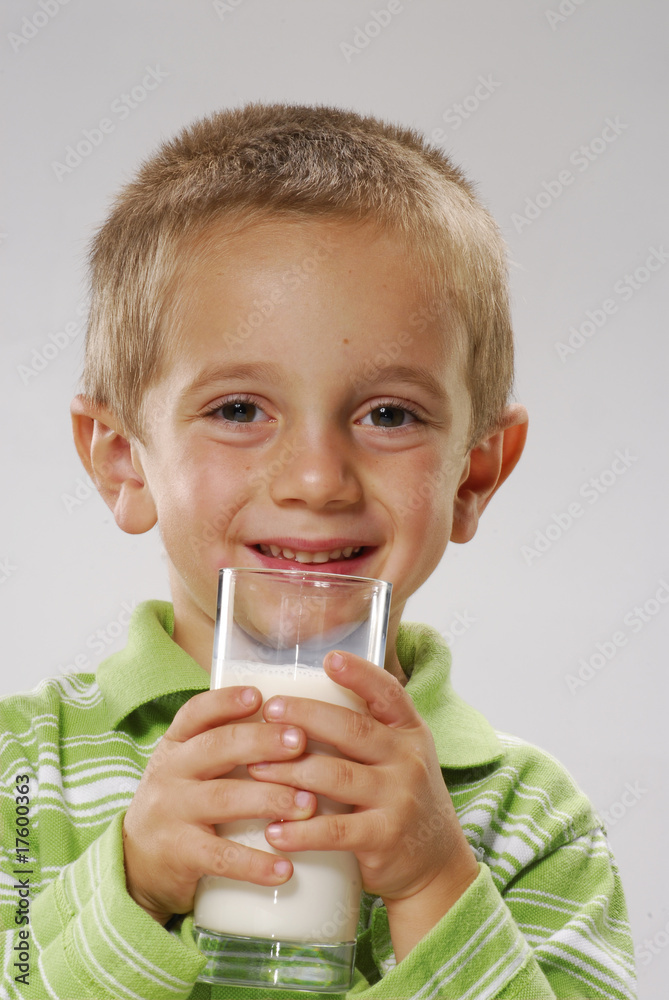 Happy boy holding a glass of milk, Happy boy holding a glass of milk,