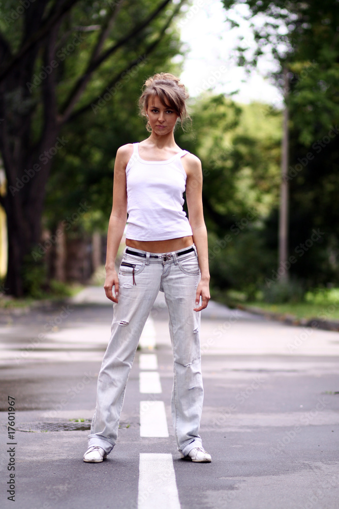 Full length, walking woman in blue jeans Full length, walking woman in blue jeans