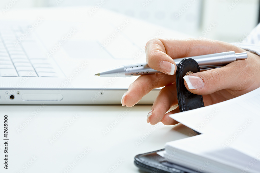 Fototapeta premium Femal hand turning page