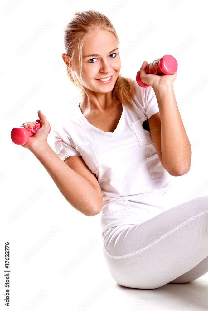 pink dumbbells in the hands of women pink dumbbells in the hands of women
