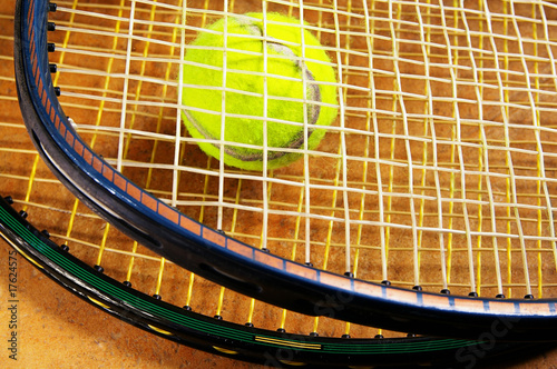 tennis rackets and a tennis ball, closeup © zimmytws