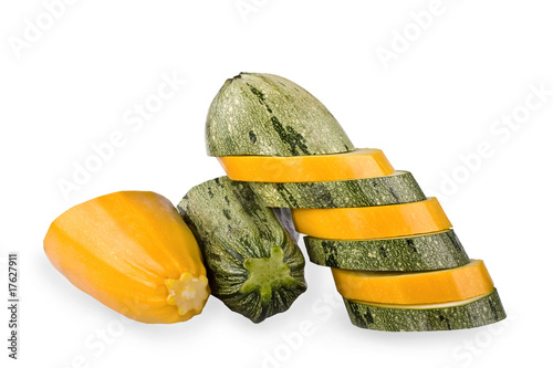 Green and yellow vegetable marrows on a white background