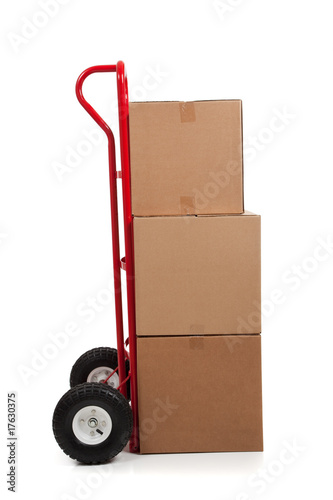 Brown cardboard moving box on white with a fragile sticker