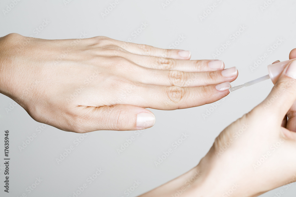 Fototapeta premium Young woman making manicure