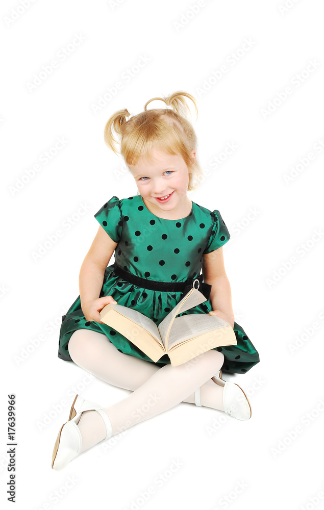 Little caucasian blonde girl reading a book Little caucasian blonde girl reading a book