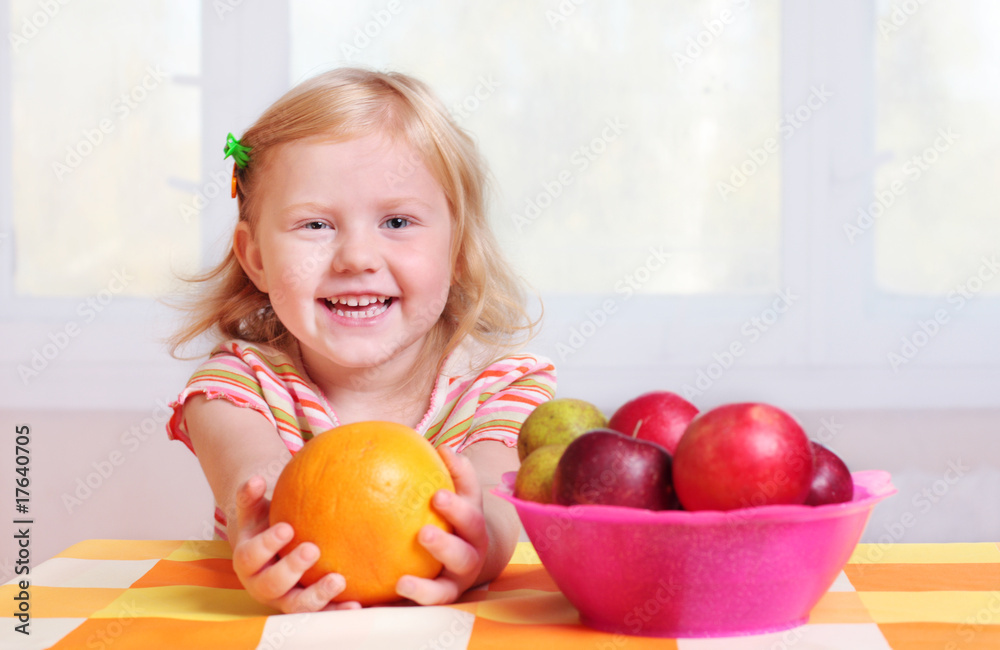 Fototapeta premium little girl with fruit