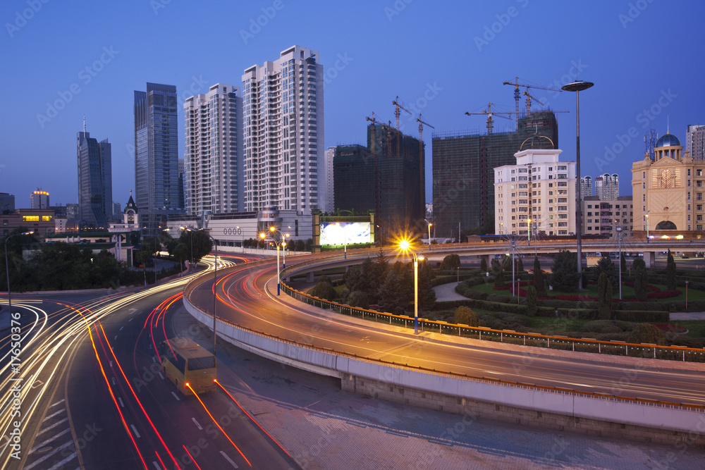 Fototapeta premium Traffic through downtown the lujiazui financial centre
