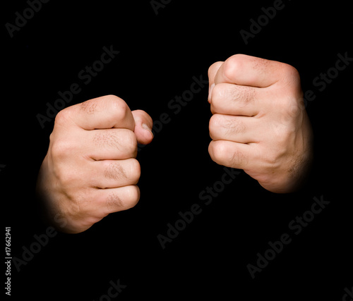 Fists isolated on black background
