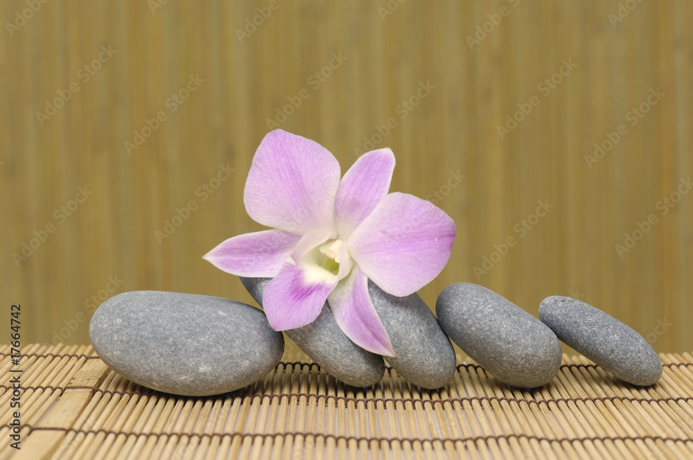 pyramid of stones with purple orchids, Spa essentials pyramid of stones with purple orchids, Spa essentials