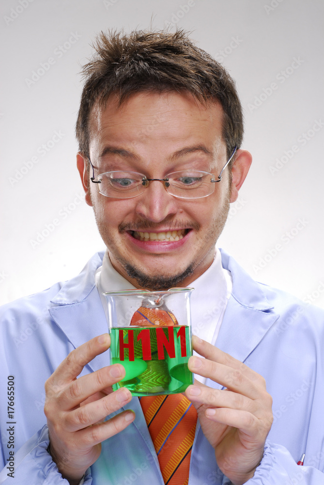 scientist holding an experimental swine flu glass. scientist holding an experimental swine flu glass.