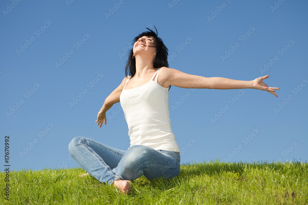 Fototapeta premium happy young woman dreams to fly on winds