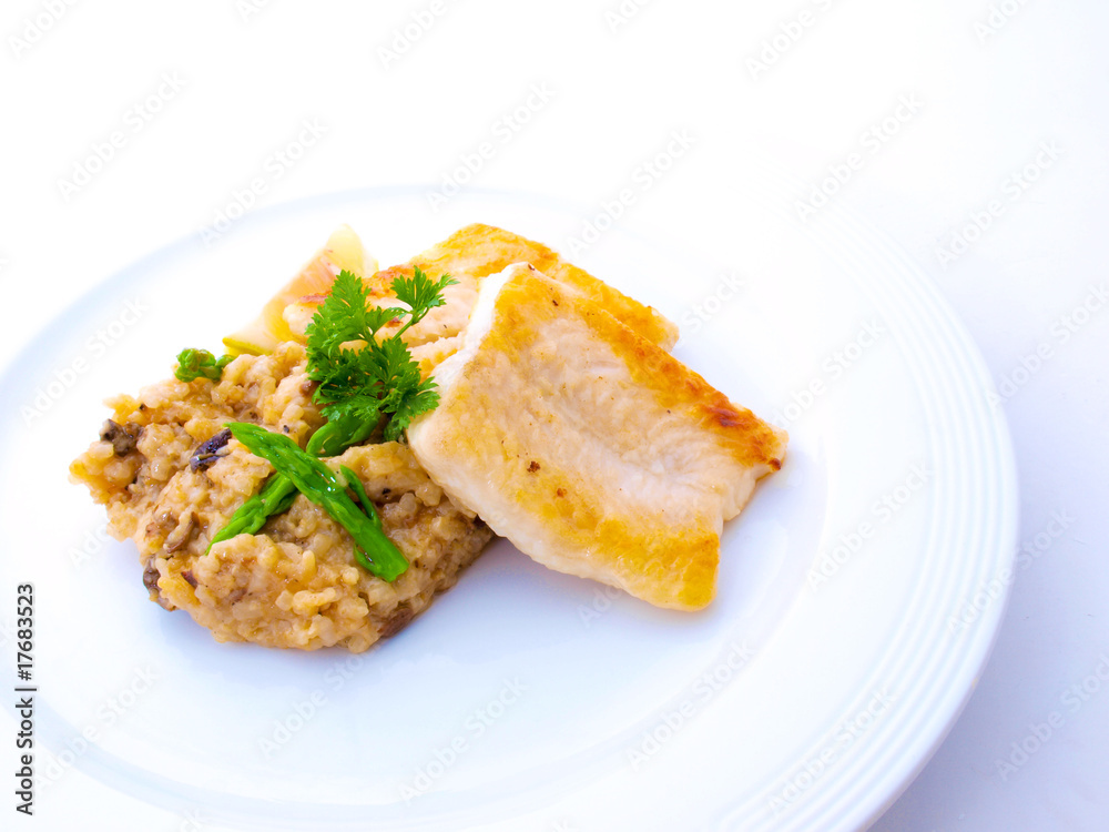Gourmet Fish Fillet with Risotto on White Plate Gourmet Fish Fillet with Risotto on White Plate