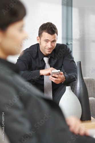 Businessman using palmtop