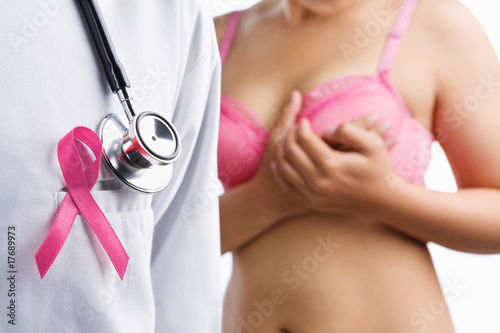 Doctor with pink badge and woman on bra photo