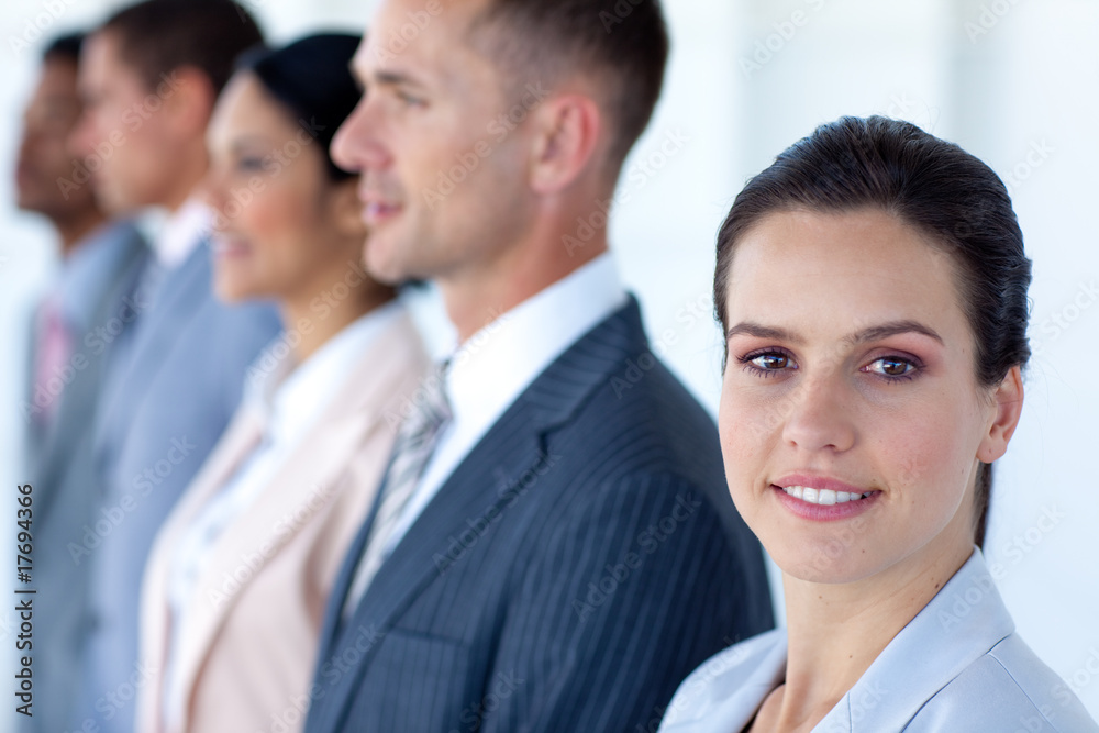 Confident businesswoman with her team in a line Confident businesswoman with her team in a line